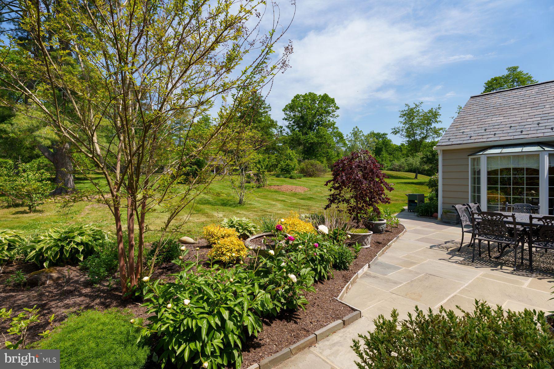 821 Pretty Brook Road Princeton, NJ 08540 - Photo 27 of 32 a backyard of a house with table and chairs