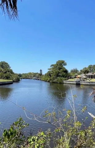 a view of a lake with a big yard