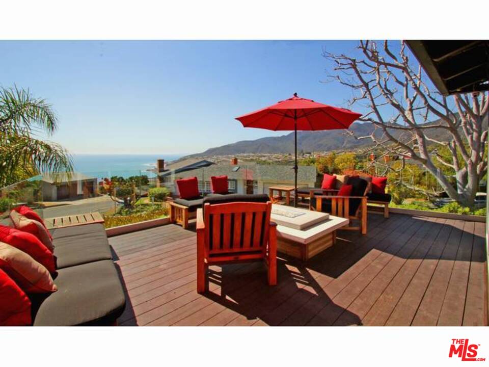204 Tranquillo Road Pacific Palisades, CA 90272 - Photo 1 of 1 a living room with furniture and wooden floor