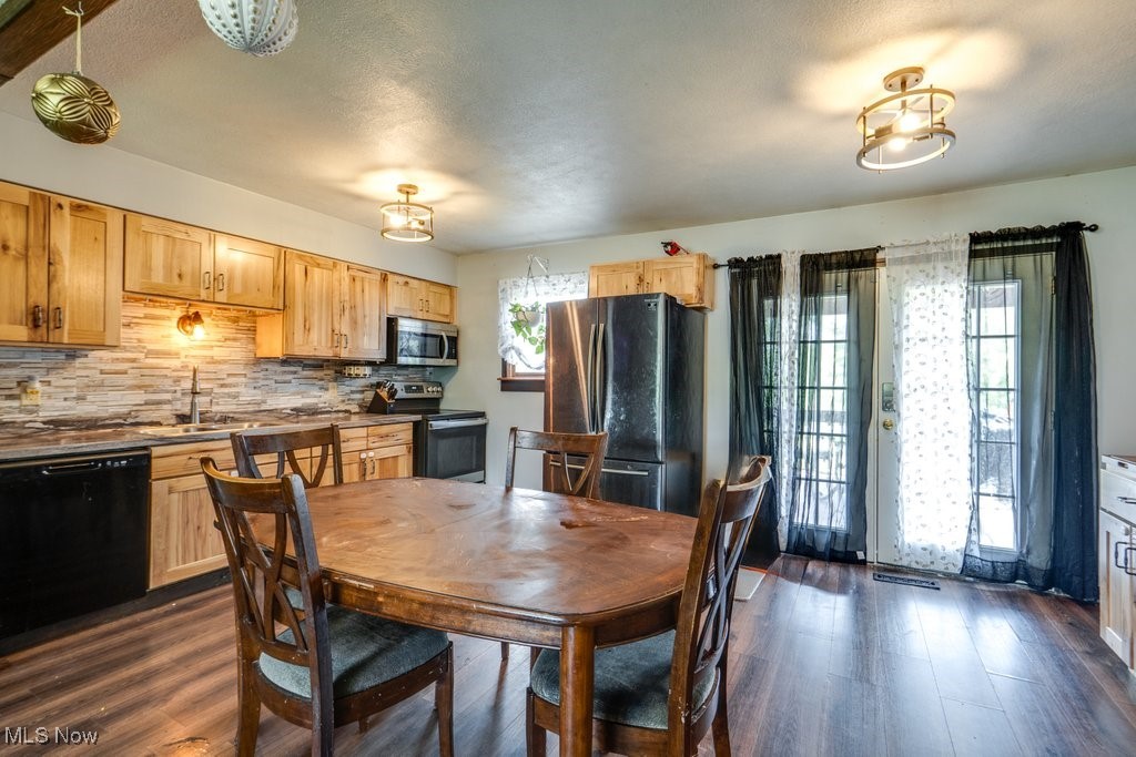 8998 Horn Road Windham, OH 44288 - Photo 11 of 34 Dining area with dark wood-style floors