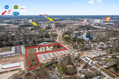 an aerial view of a chairs and table on the roof deck