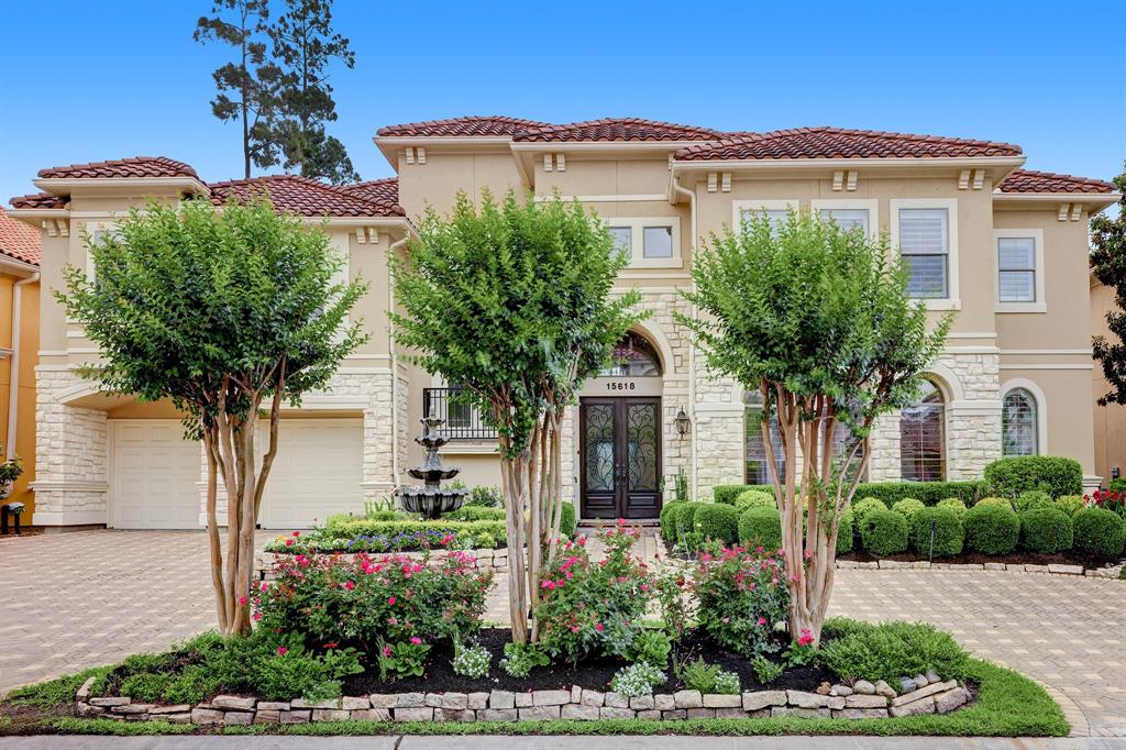 15618 Azalea Shores Drive Houston, TX 77070 - Photo 1 of 48 a front view of a house with a yard and potted plants