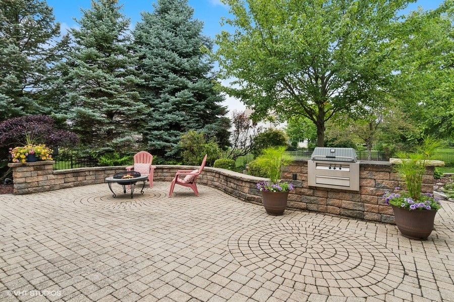 3179 Kingbird Lane Naperville, IL 60564 - Photo 11 of 52 a view of a bench with potted plants