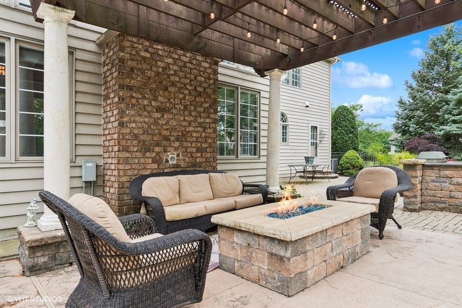 3179 Kingbird Lane Naperville, IL 60564 - Photo 13 of 52 a outdoor living space with patio furniture and a potted plant