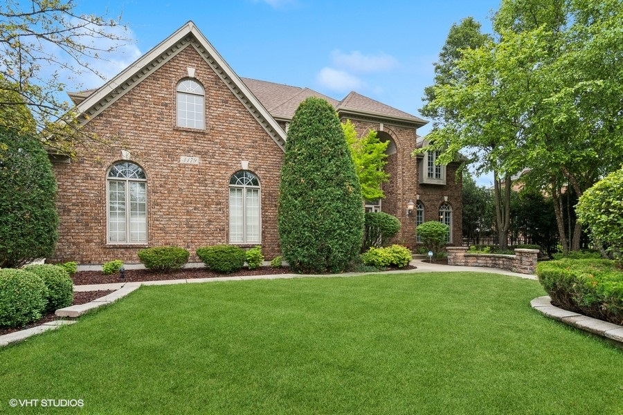 3179 Kingbird Lane Naperville, IL 60564 - Photo 2 of 52 a front view of a house with a yard