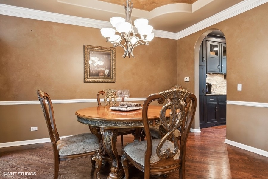 3179 Kingbird Lane Naperville, IL 60564 - Photo 29 of 52 a view of a dining room with furniture and wooden floor
