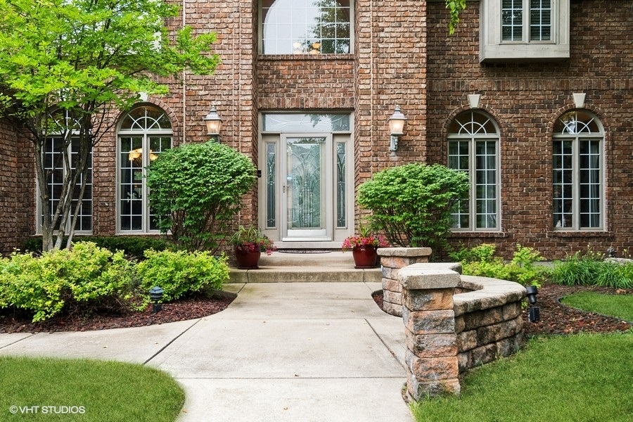 3179 Kingbird Lane Naperville, IL 60564 - Photo 3 of 52 a view of a house with potted plants and a bench
