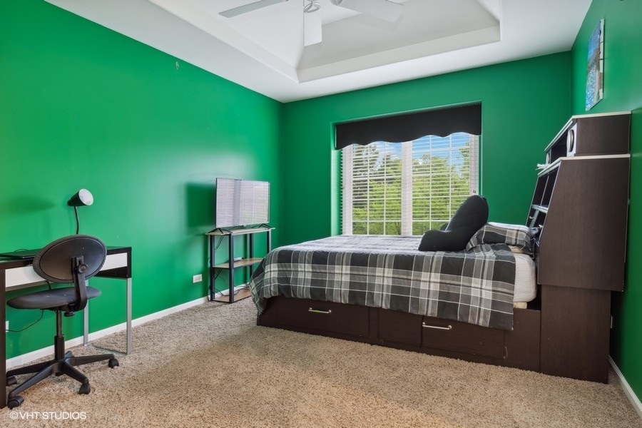 3179 Kingbird Lane Naperville, IL 60564 - Photo 38 of 52 a bedroom with furniture and a window