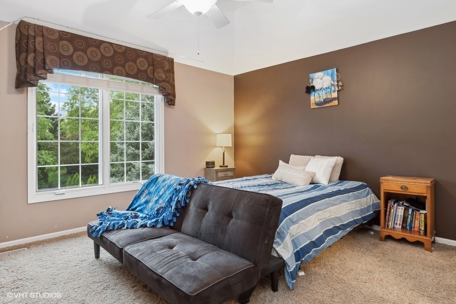 3179 Kingbird Lane Naperville, IL 60564 - Photo 39 of 52 a bedroom with bed and window