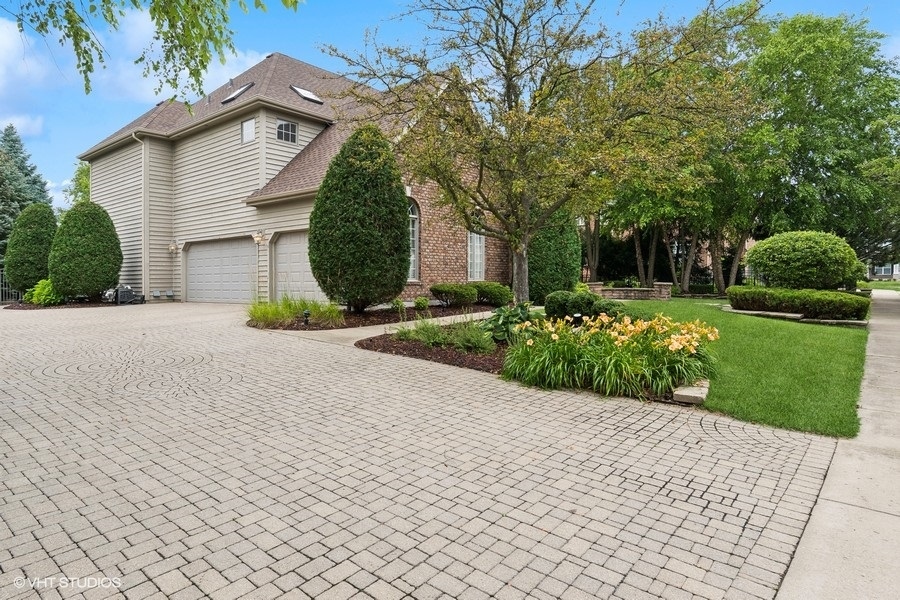 3179 Kingbird Lane Naperville, IL 60564 - Photo 4 of 52 a front view of a house with a yard and garage