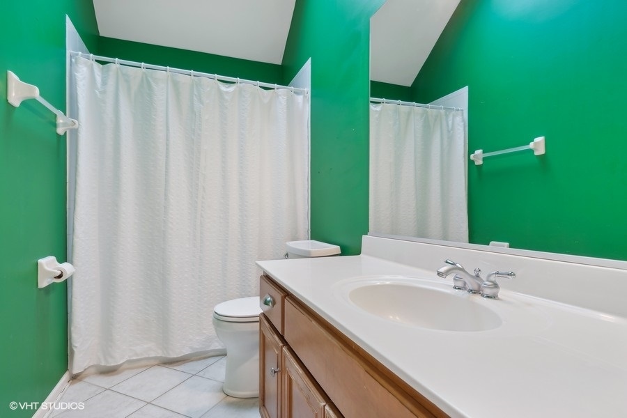 3179 Kingbird Lane Naperville, IL 60564 - Photo 41 of 52 a bathroom with a sink and toilet