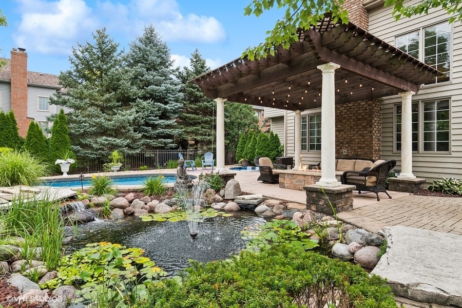 3179 Kingbird Lane Naperville, IL 60564 - Photo 7 of 52 a view of a chair and tables in the patio in front of a house