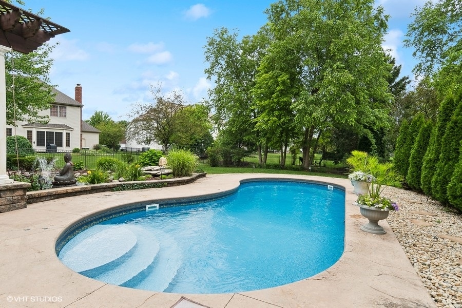 3179 Kingbird Lane Naperville, IL 60564 - Photo 9 of 52 a view of a swimming pool with a patio