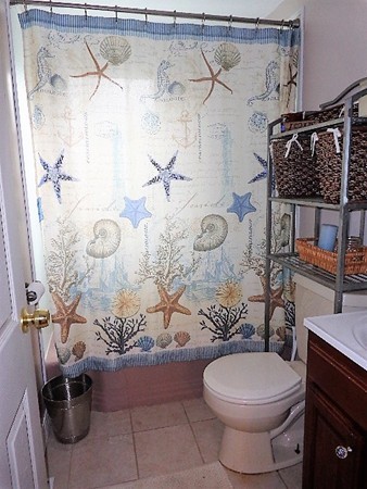 10 Sylvan Road Holbrook, MA 02343 - Photo 14 of 23 a bathroom with a toilet sink and shower