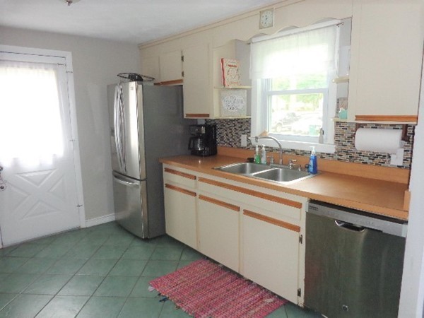 10 Sylvan Road Holbrook, MA 02343 - Photo 4 of 23 a kitchen with a sink appliances and cabinets