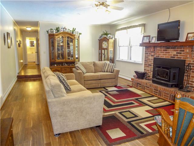 1186 Pleasant Ridge Road Goodspring, TN 38460 - Photo 11 of 20 a living room with furniture and a fireplace