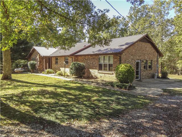 1186 Pleasant Ridge Road Goodspring, TN 38460 - Photo 2 of 20 a front view of a house with garden