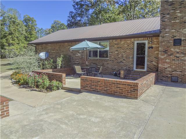 1186 Pleasant Ridge Road Goodspring, TN 38460 - Photo 7 of 20 front view of a house with a bench