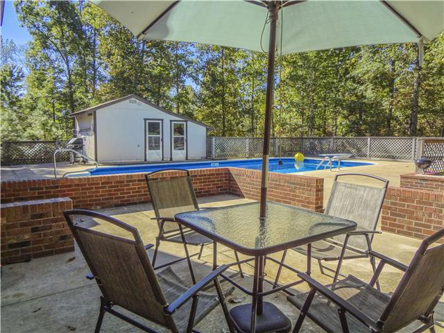 1186 Pleasant Ridge Road Goodspring, TN 38460 - Photo 8 of 20 a view of an outdoor space with swimming pool and furniture