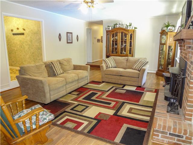 1186 Pleasant Ridge Road Goodspring, TN 38460 - Photo 10 of 20 a living room with lots of furniture and a rug