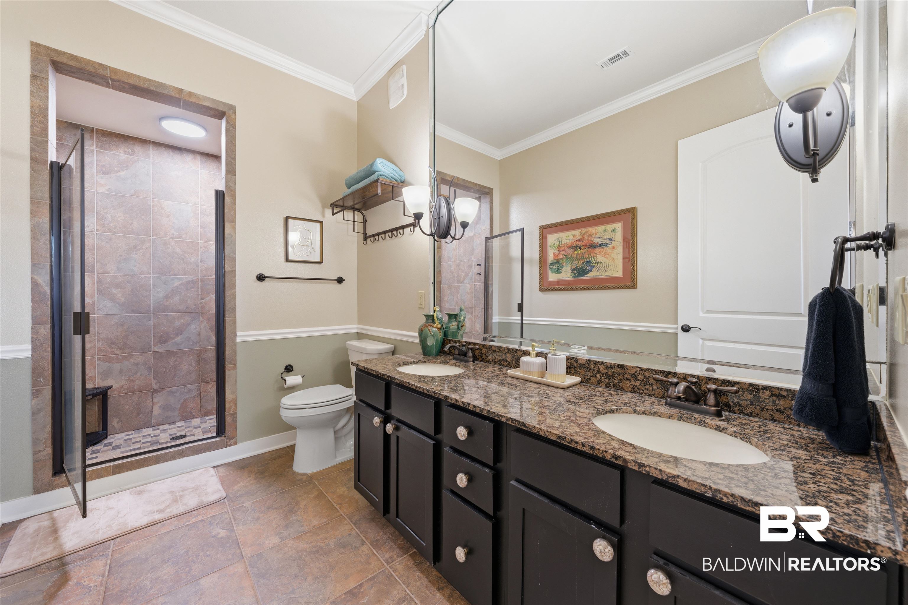 1430 Regency Road, Unit H202 Gulf Shores, AL 36542 - Photo 12 of 25 Bathroom featuring a shower stall, double vanity, and ornamental molding
