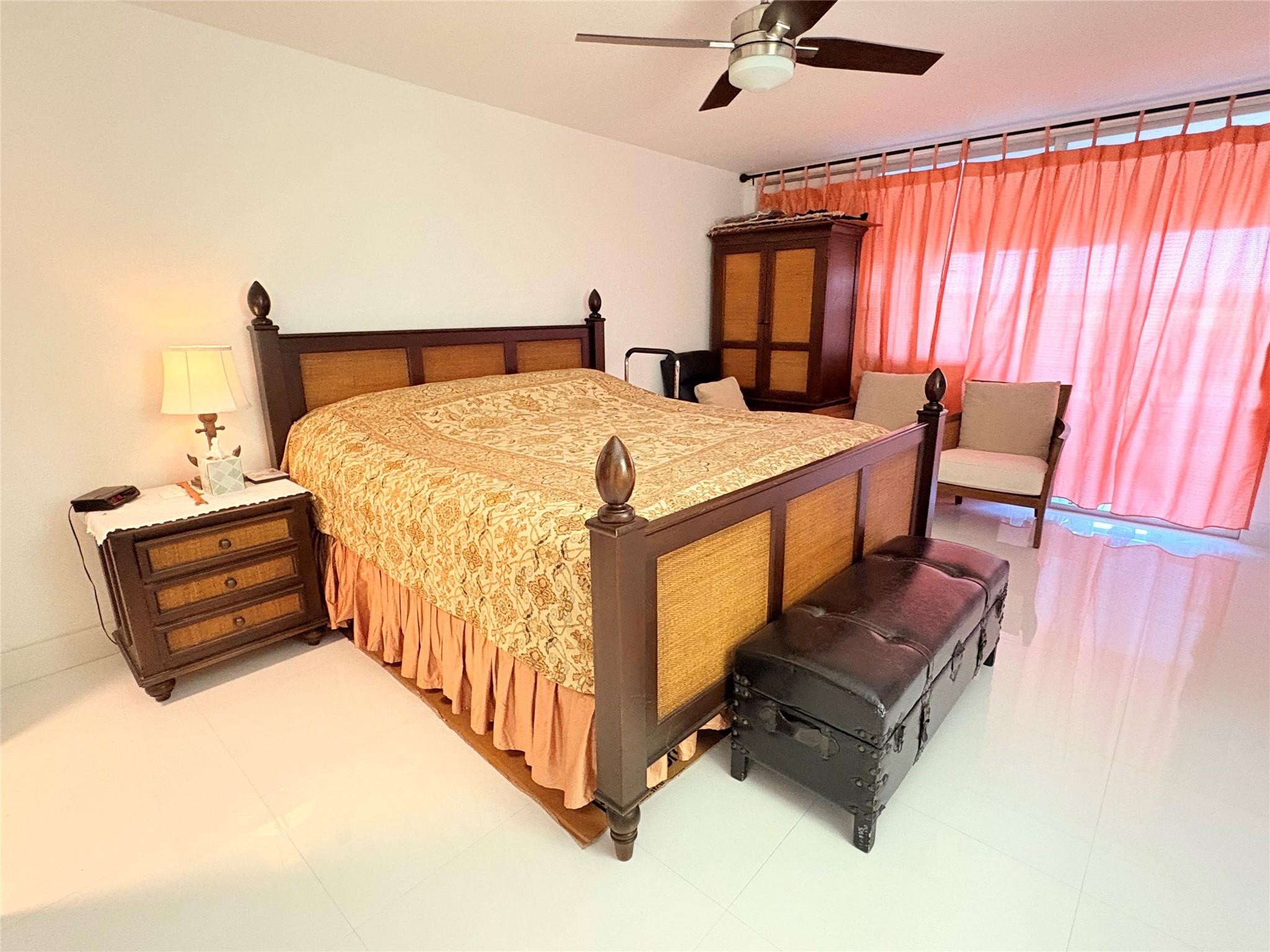 23099 Barwood Lane North, Unit 308 Boca Raton, FL 33428 - Photo 6 of 10 a bedroom with a bed and window