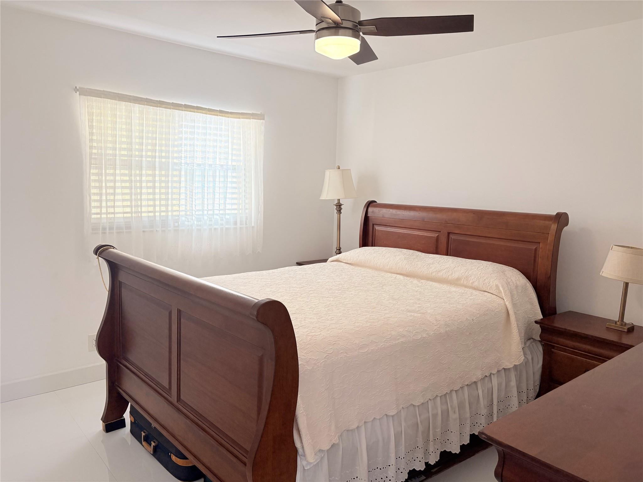 23099 Barwood Lane North, Unit 308 Boca Raton, FL 33428 - Photo 9 of 10 a bedroom with bed and window