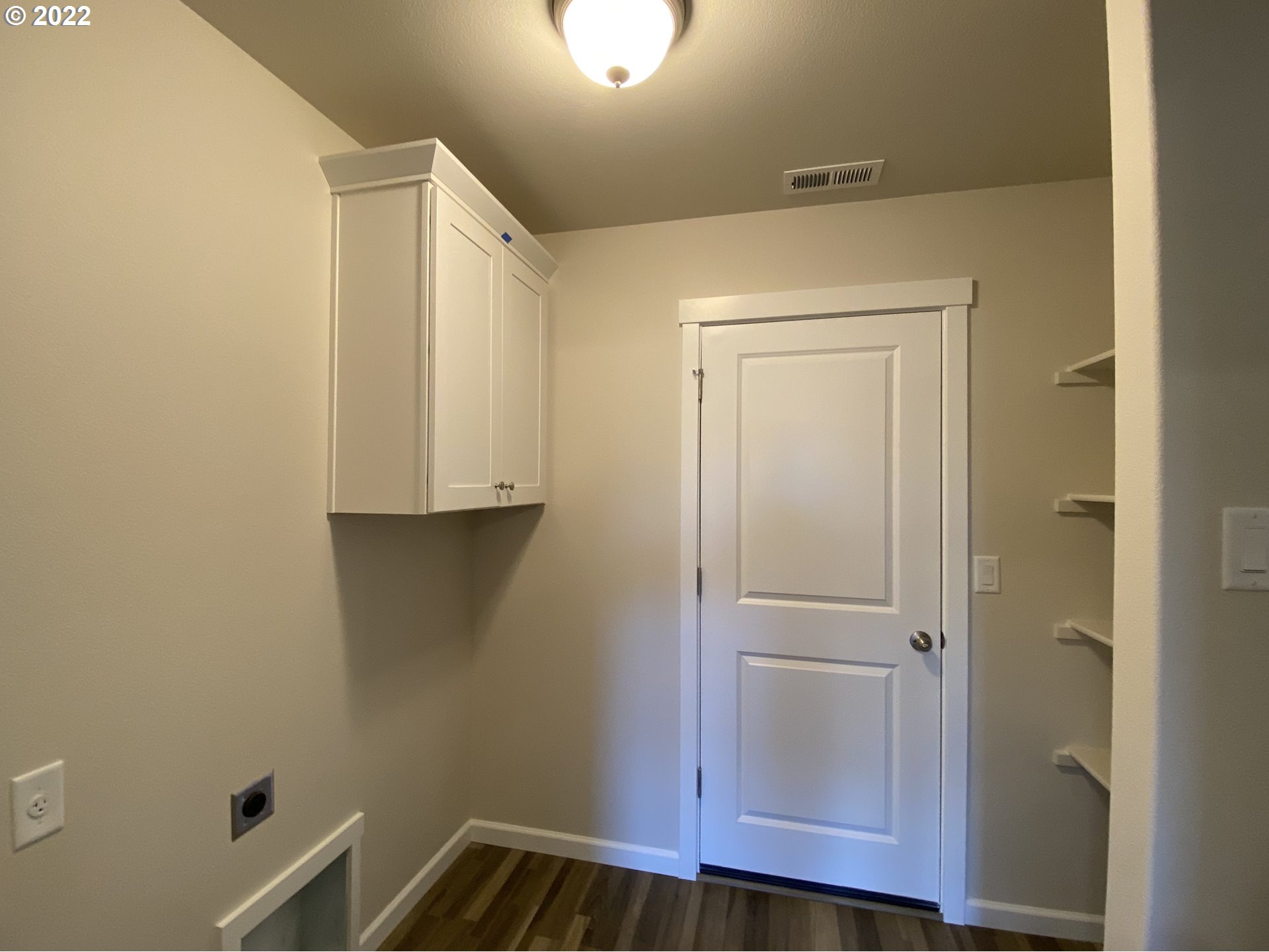 413 Southeast Ray Street, Unit 39 Dallas, OR 97338 - Photo 11 of 15 a view of walk in closet with wooden floor
