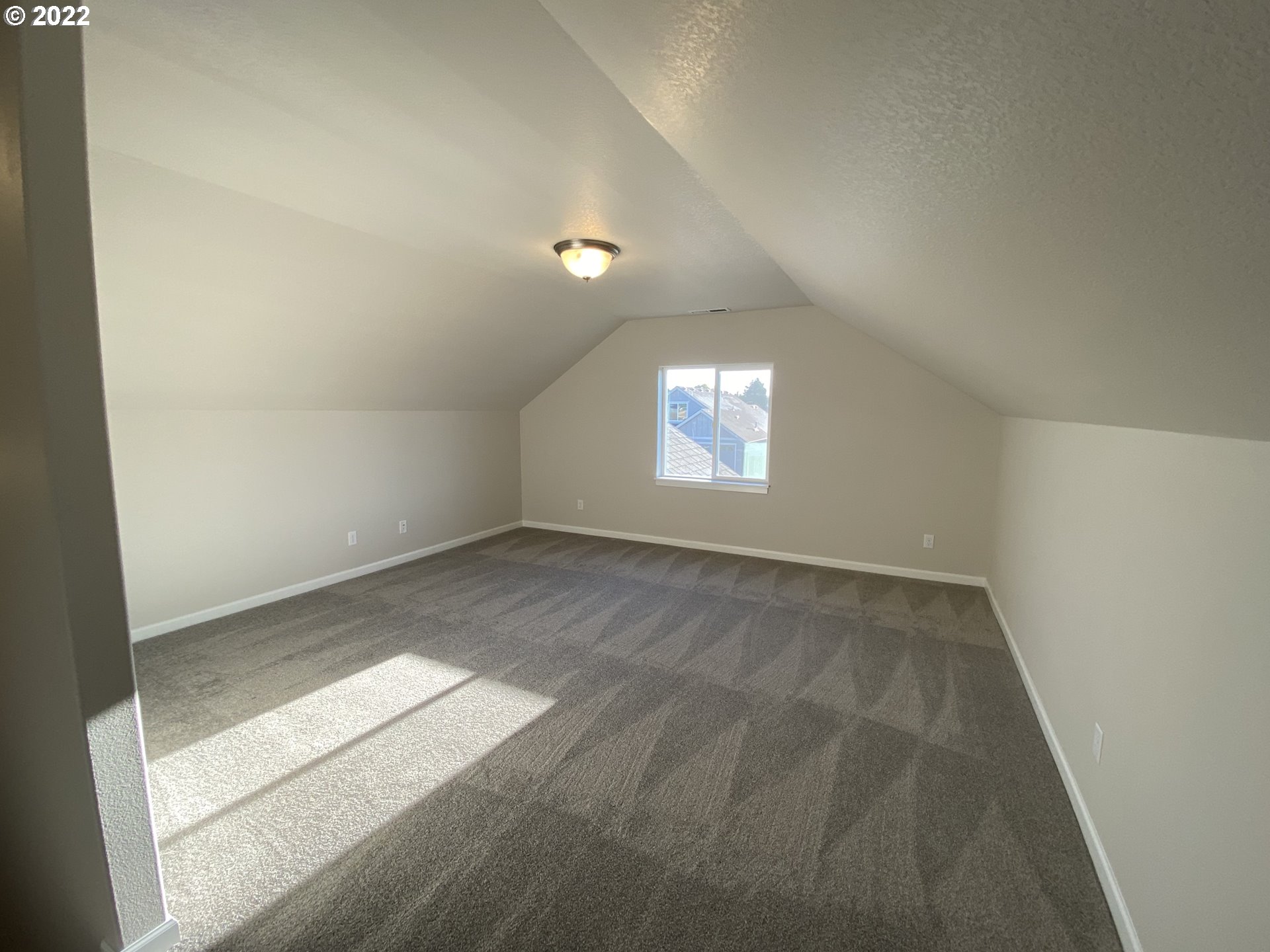 413 Southeast Ray Street, Unit 39 Dallas, OR 97338 - Photo 13 of 15 an empty room with windows