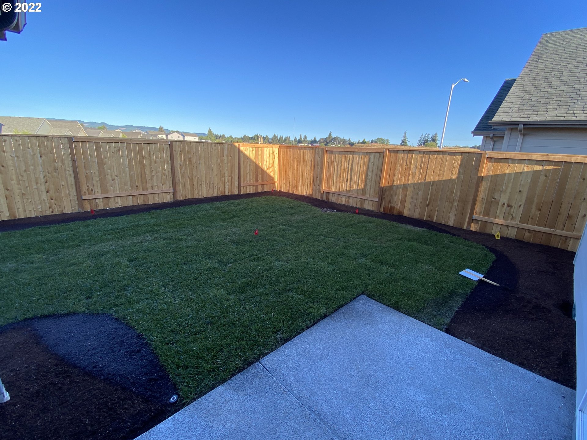 413 Southeast Ray Street, Unit 39 Dallas, OR 97338 - Photo 15 of 15 a view of a backyard with wooden fence
