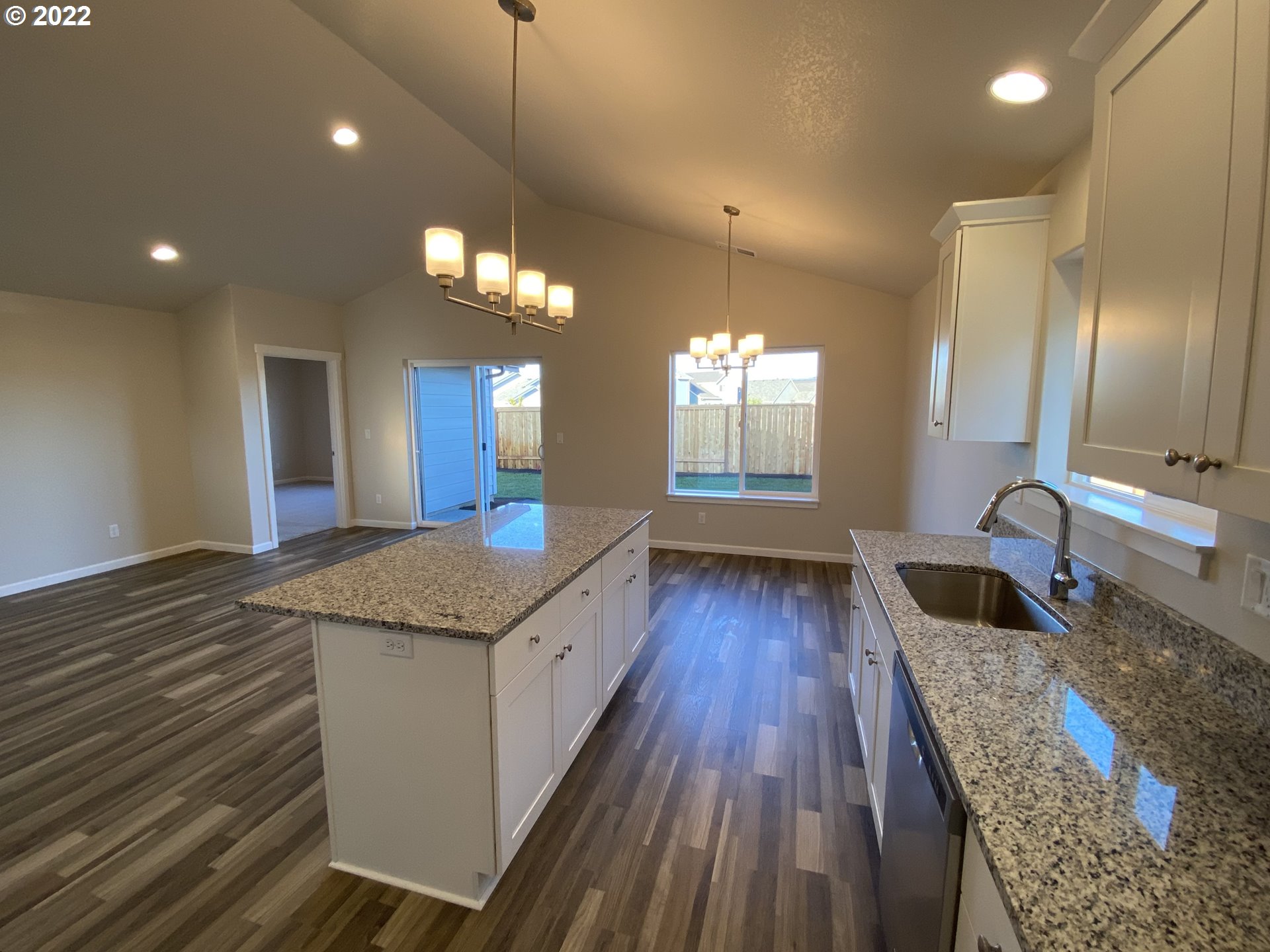 413 Southeast Ray Street, Unit 39 Dallas, OR 97338 - Photo 4 of 15 a bathroom with a granite countertop sink and a large mirror