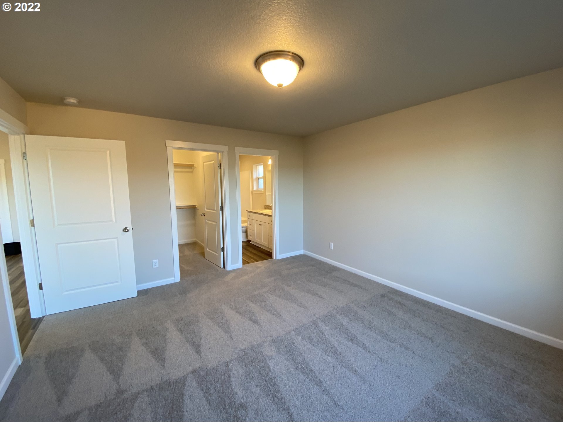 413 Southeast Ray Street, Unit 39 Dallas, OR 97338 - Photo 7 of 15 a view of an empty room and window