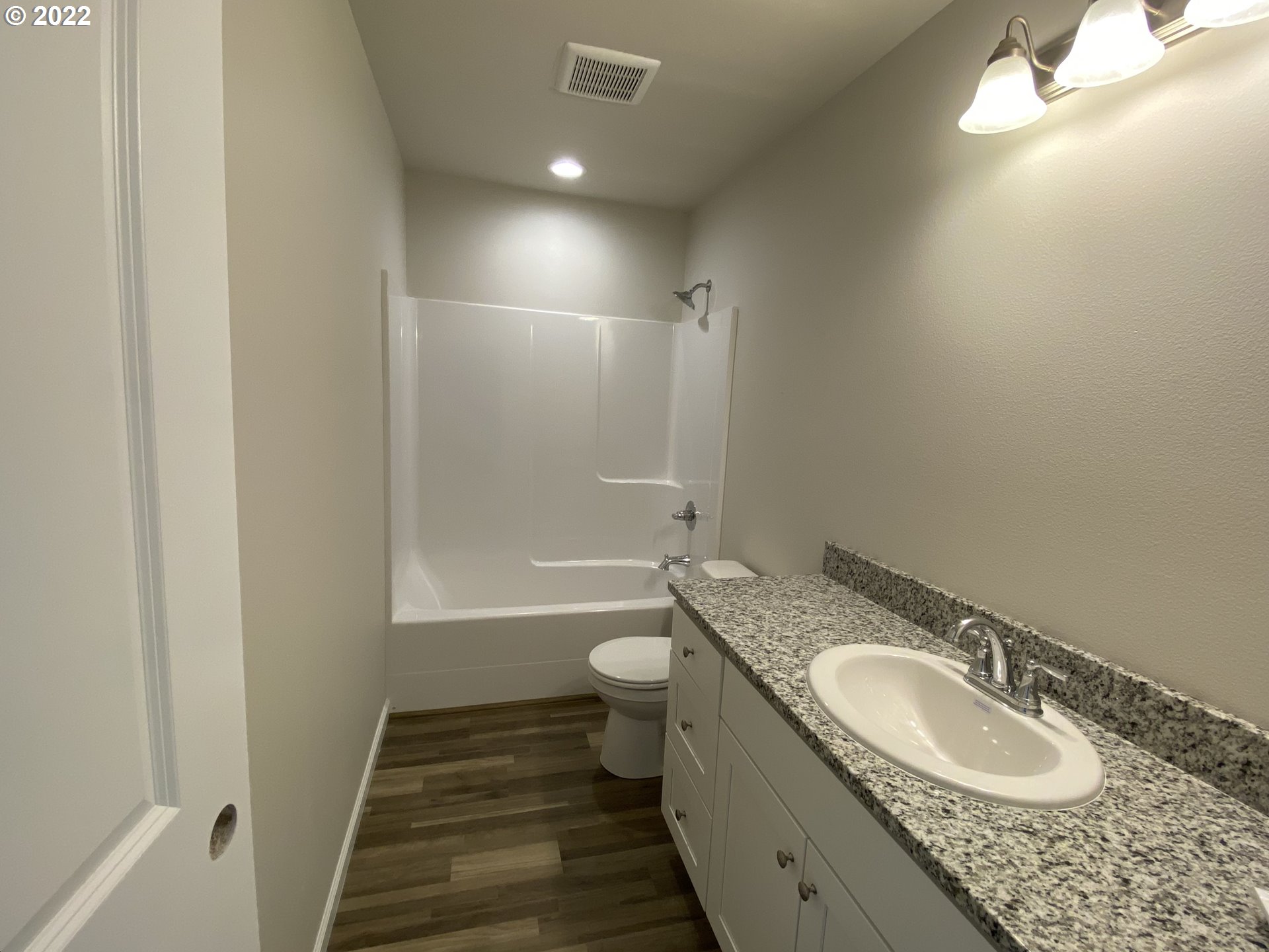 413 Southeast Ray Street, Unit 39 Dallas, OR 97338 - Photo 10 of 15 a bathroom with a granite countertop double vanity sink and a mirror