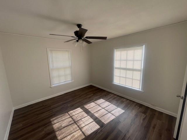 7428 Gaston Avenue Fort Worth, TX 76116 - Photo 16 of 17 wooden floor in an empty room with a window