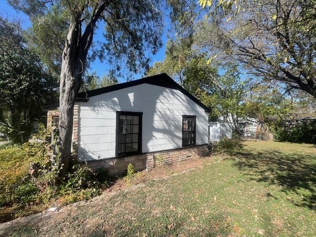 7428 Gaston Avenue Fort Worth, TX 76116 - Photo 3 of 17 a view of a house with a yard
