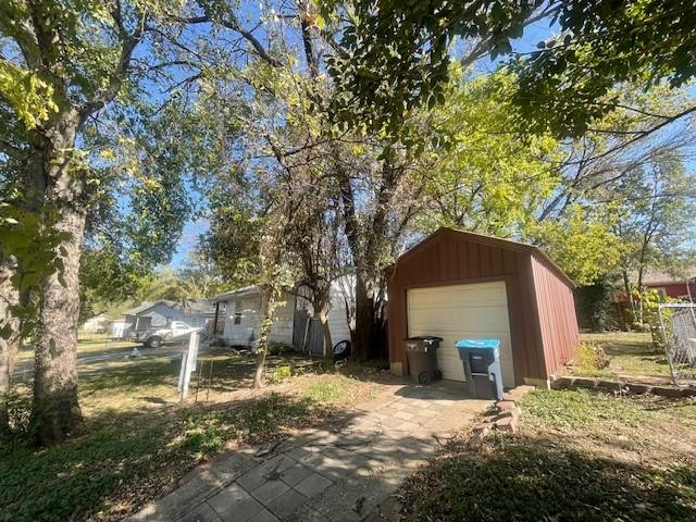 7428 Gaston Avenue Fort Worth, TX 76116 - Photo 6 of 17 a front view of a house with a yard and garage