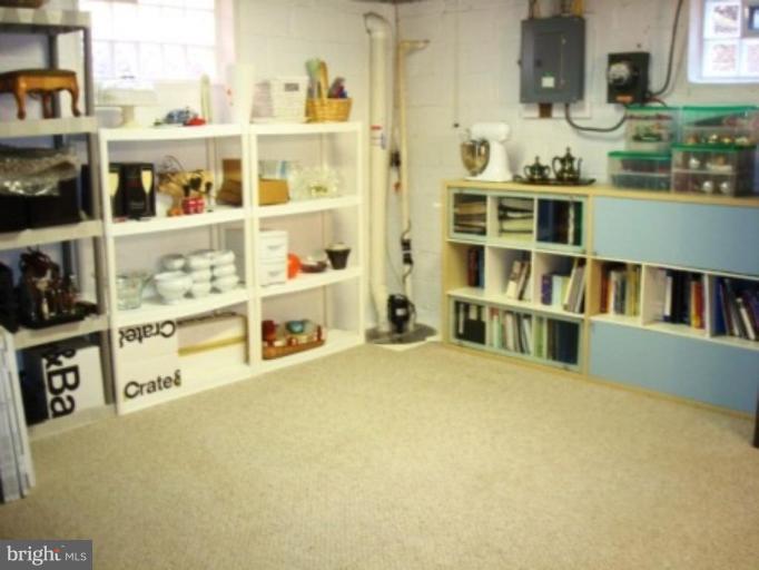 7209 Lanark Road Baltimore, MD 21212 - Photo 15 of 15 a room with a bed and a book shelf