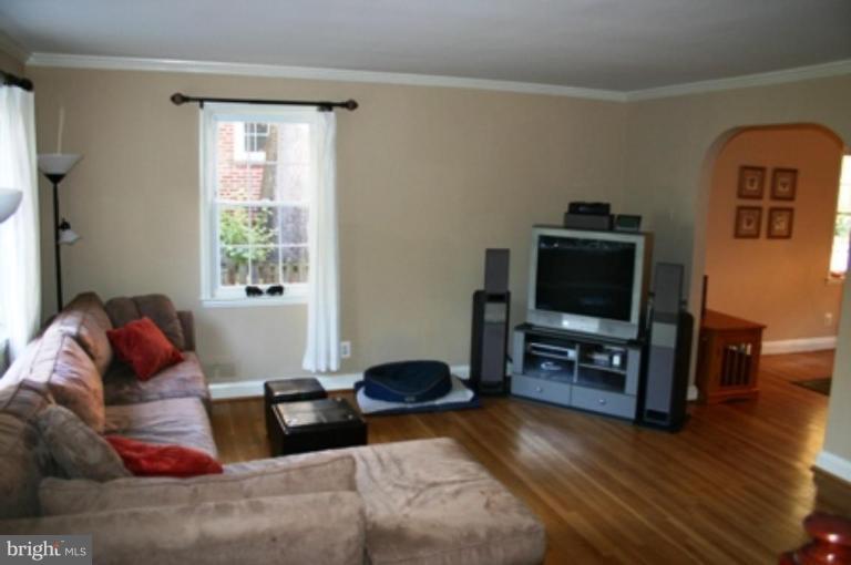 7209 Lanark Road Baltimore, MD 21212 - Photo 4 of 15 a living room with furniture and a flat screen tv