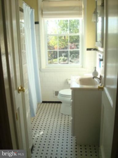7209 Lanark Road Baltimore, MD 21212 - Photo 10 of 15 a bathroom with a sink a toilet and a shower