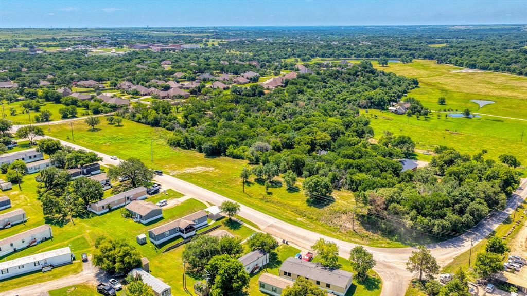 619 Old Annetta Road Aledo, TX 76008 - Photo 3 of 16 Expansive green spaces and mature trees characterize this aerial landscape