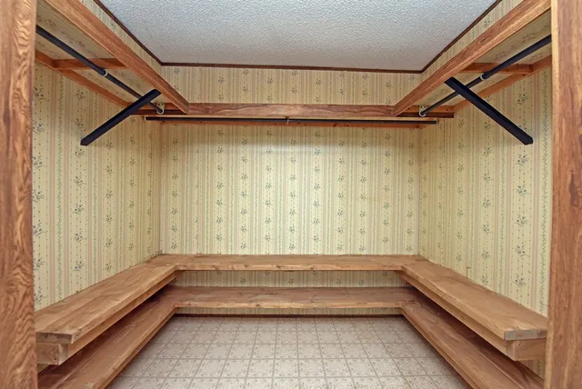 a bathroom with a tub and shower