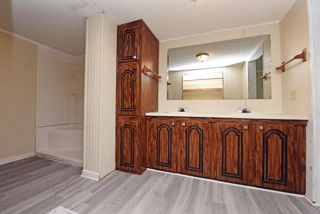a view of a door with wooden floor