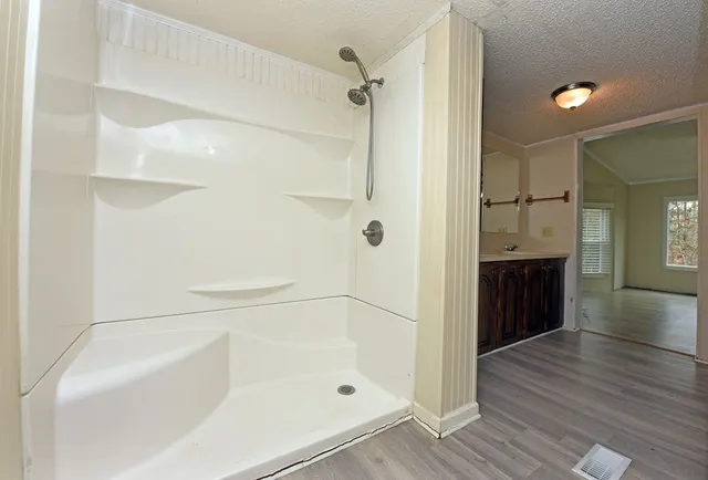 a bathroom with a bathtub and a shower