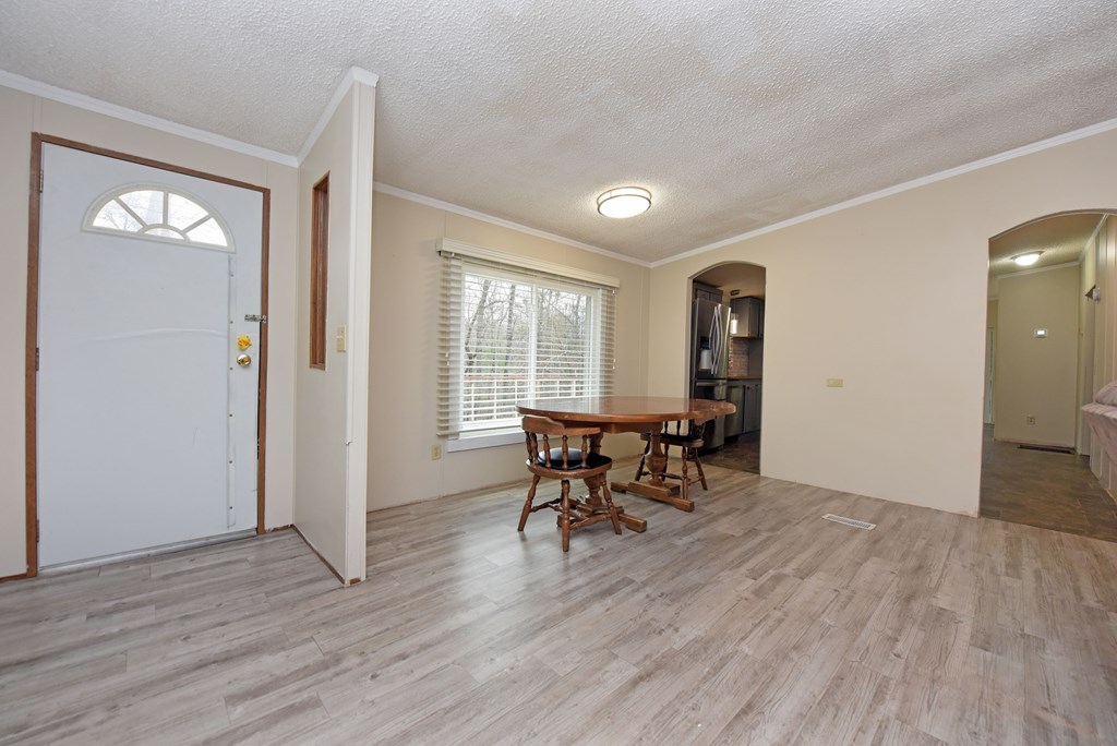 85 Truelove Road Blairsville, GA 30512 - Photo 17 of 35 an empty room with wooden floor and a window
