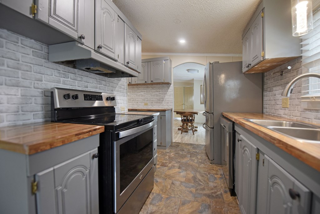 85 Truelove Road Blairsville, GA 30512 - Photo 23 of 35 a kitchen with a stove and a sink