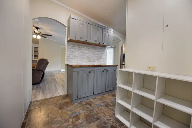 a view of an empty room with a cabinet