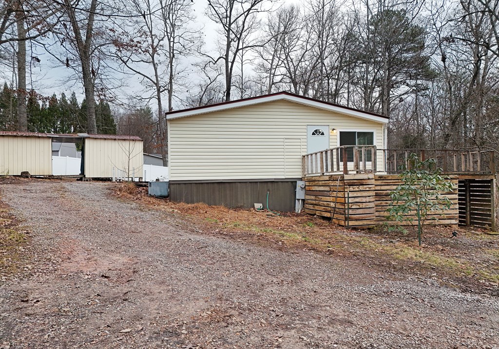 85 Truelove Road Blairsville, GA 30512 - Photo 33 of 35 a backyard of a house with wooden fence and large trees