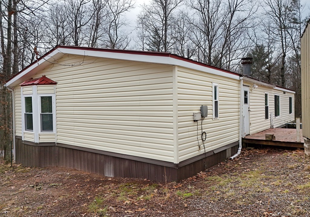 85 Truelove Road Blairsville, GA 30512 - Photo 34 of 35 a view of a white house with a large window and wooden fence