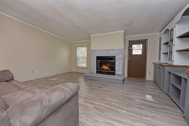 a bedroom with a bed and a fireplace