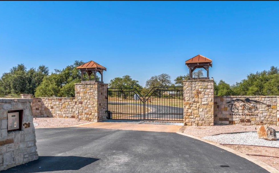 285 Comanche Ridge Round Mountain, TX 78663 - Photo 3 of 4 Gate featuring a gazebo and a patio
